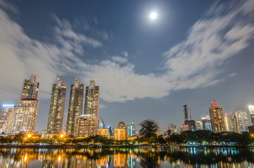 Fototapeta na wymiar Cityscape of Benjakiti park Bangkok downtown city at night twilight evening, Bangkok Thailand..