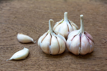 Garlic on wooden vintage background.