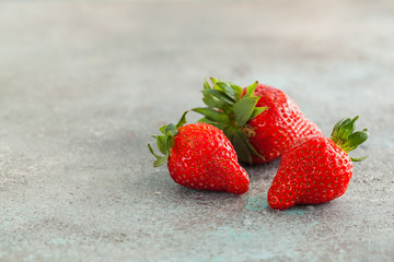 Strawberry. Fresh strawberry on dark background . Red strawberry. Loosely laid strawberries in different positions. Copyspace.