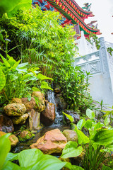 wonderful blooming green park with a waterfall. Malaysia