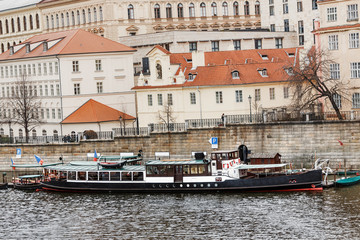 Fototapeta na wymiar Panoramic view of Vltava river in Prague with tourist ship
