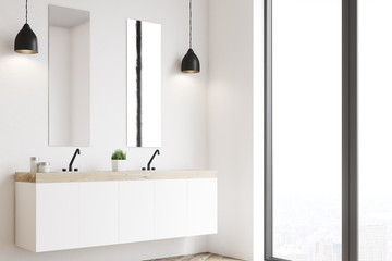 Double sink, white wall, side view