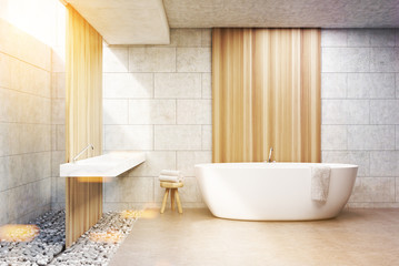 Fototapeta na wymiar Gray brick bathroom, white tub, front, toned