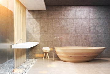 Fototapeta na wymiar Gray bathroom, wooden tub, front, toned