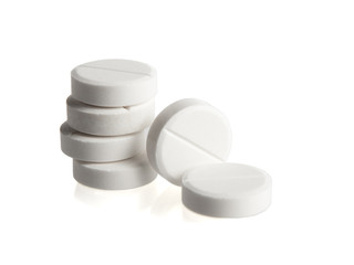 Heap of medical pills on white background