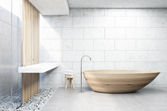 Gray brick bathroom, wooden tub, front