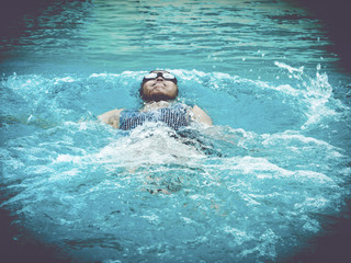 women exercise by swimming to stay healthy.