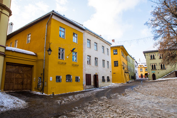 Medieval street view in city Sighisoara, Romania like a point of destination of touristic route.