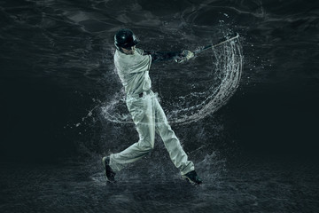 Baseball players in action under water