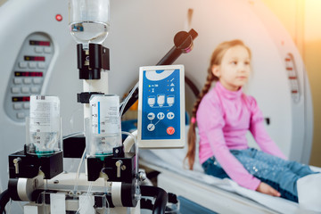 Medical equipment. Doctor and patient in the room of computed tomography