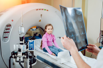 Medical equipment. Doctor and patient in the room of computed tomography