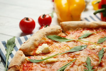 Delicious pizza with ingredients, closeup