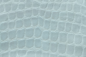 Light green background from soft upholstery textile material, closeup. Fabric with pattern