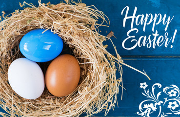 Bright colored dyed eggs on wooden table. Happy Easter eggs card