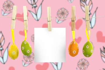 Composite image of hanging easter eggs