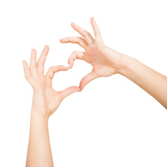 Woman's hands show heart shape on white backgrounds