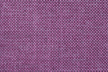 Magenta textile background with checkered pattern, closeup. Structure of the fabric macro.