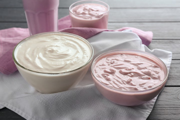 Dishes with homemade yogurt on table