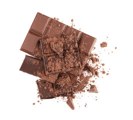 Broken chocolate pieces and cocoa powder on white background
