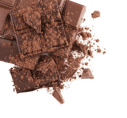 Broken chocolate pieces and cocoa powder on white background