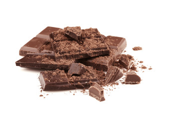Broken chocolate pieces and cocoa powder on white background