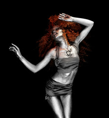 Beautiful young woman with amazing body-art as lion on dark background. Zodiac signs concept