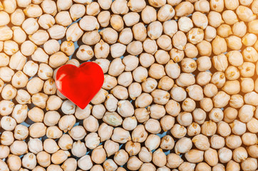 Healthy eating, chickpeas beans background and heart symbol