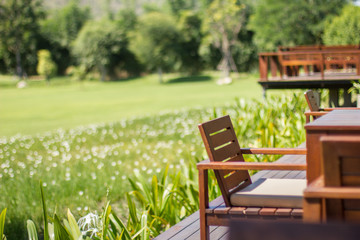 Wooden chair with garden view background