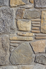 The wall of natural sne with a combination of styling. texture Wall from natural river stone