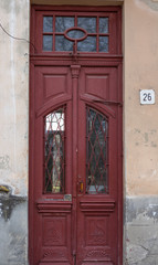 Old wooden red door, the historic city of Drohobych, Ukraine. Old wooden door