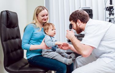 Direct ophthalmoscopy. Retinal examination. Fundoscopy. Child vision test.