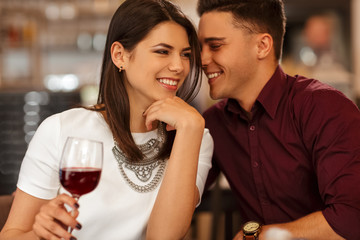 Affectionate loving couple cuddling on a restaurant date