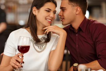 Affectionate loving couple cuddling on a restaurant date
