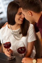 Affectionate loving couple cuddling on a restaurant date