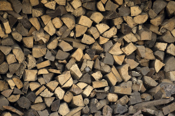 wall firewood , Background of dry chopped firewood logs in a pile