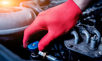 Servicing car air conditioner. Service station.