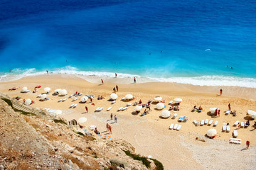 People are resting on the beach on the Mediterranean Sea.