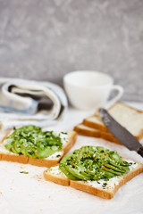 Toast with avocado, feta cheese, herbs and sesame seeds. Healthy eating and wholesome Breakfast