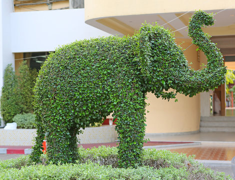 Live elephant statue made of grass