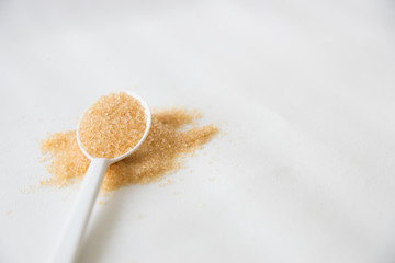 Brown sugar on white background.