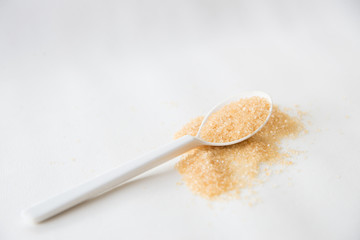 Brown sugar on white background.