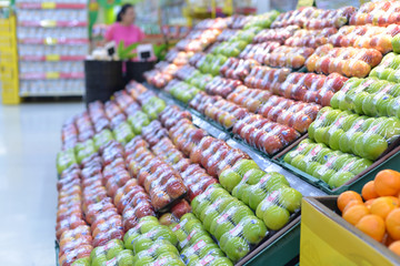 Red and green apple fruits in a supermarket