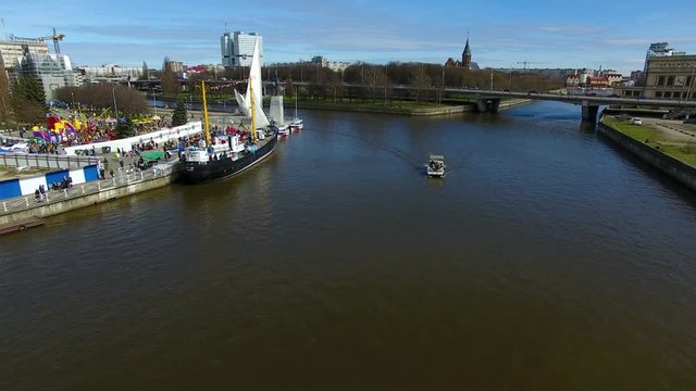 The tourist boat passes through a canal in Kaliningrad, view from above