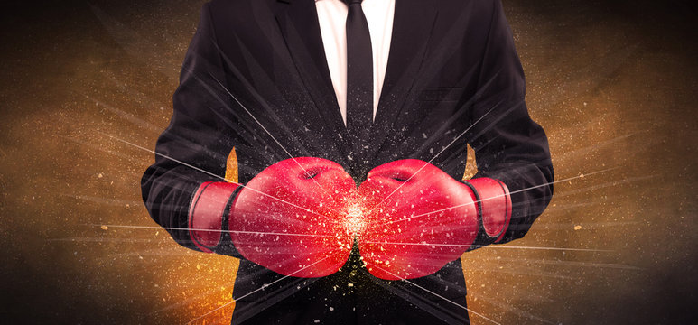 Forceful businessman boxing