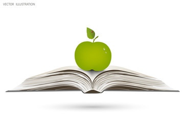 Apple on open book.