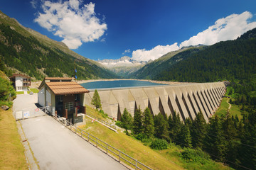 Dam and Lago di Malga Bisiina, Care alto peak in background, Alps, Italy