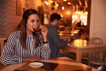 Lovely millenial girl drinking her tea