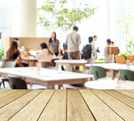 Empty wood perspective,table top, over blur group of people team meeting at co-working space background, teamwork, business and education concept , template, for product display montage