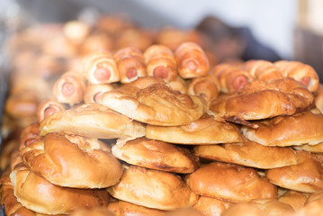 Oven fresh home made baked patties. Delicious pastries on a baking sheet. Russian pirozhki (baked patties). Traditional russian pies, good food for holiday