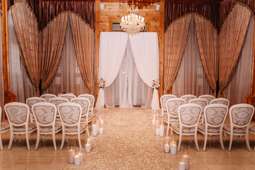 Interior of a wedding hall decoration in white and brown colors